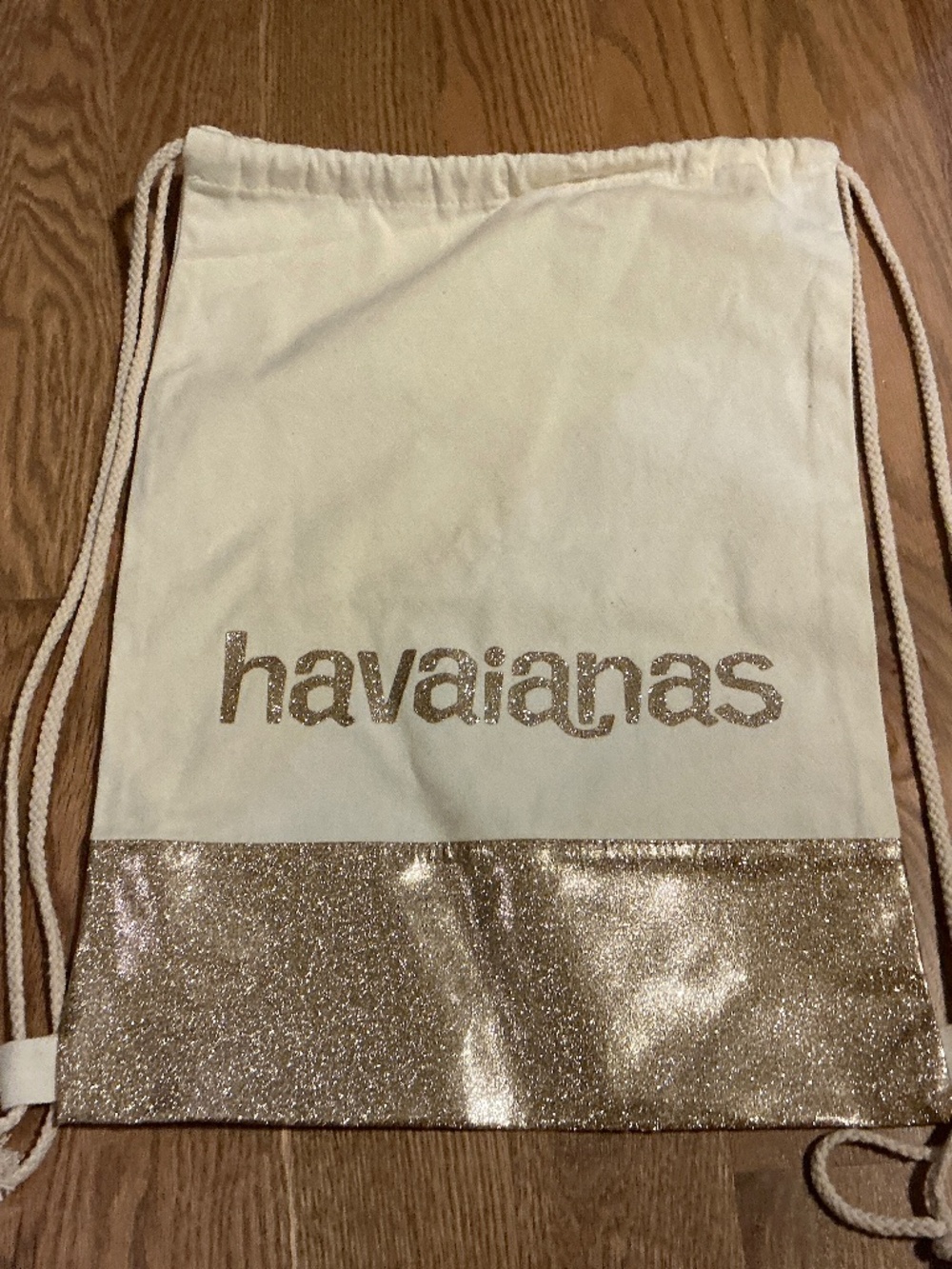 Havainas Drawstring Canvas Bag. Gold Glitter letters and gold trim bottom.